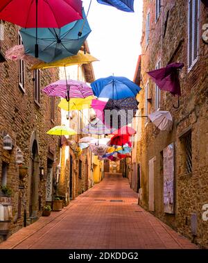 Street with colorful umbrellas in Paciano (Umbria)