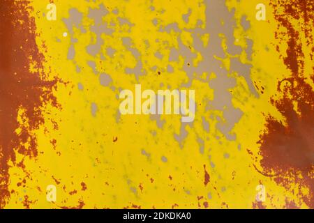 Texture background of old linoleum abstractly painted with paint with scuffs and spots of yellow, brown and gray Stock Photo