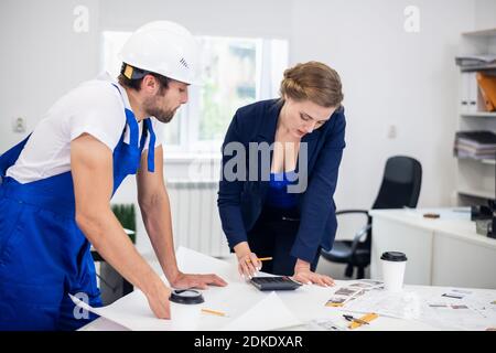 Two architects working on a project in the office. Stock Photo