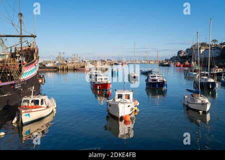 Brixham harbour boats on beautiful calm winter day in Devon town