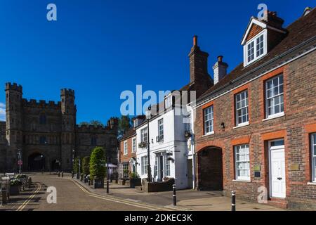 England, East Sussex, Battle, High Street Shops and Battle Abbey Gatehouse Stock Photo