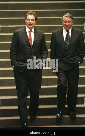 British Prime minister Tony Blair, accompanied by presiding officer Sir David Steel, leaving the Scottish parliament on the Mound in Edinburgh where he addressed MSPs at the parliament for the first time since government was devolved to Scotland. The General Assembly housed the Scottish parliament after it was opened on July 1st 1999 until the purpose-built building was completed at Holyrood in 2004. The new parliament gave Scots limited devolved powers from the United Kingdom government in London for the first time since 1707. Stock Photo