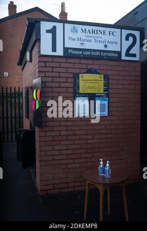 The turnstiles with hand sanitiser waiting for spectators to arrive before Marine play Hyde United in an FA Trophy first round tie at the Marine Travel Arena, formerly known as Rossett Park, in Crosby. Due to coronavirus regulations which had suspended league games, the Merseysiders’ only fixtures were in cup competitions, including their forthcoming tie against Tottenham Hotspur in the FA Cup third round. Marine won the game by 1-0, watched by a permitted capacity of 400, with the visitors having two men sent off in the second half. Stock Photo