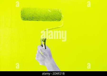 Someone painting wall Stock Photo