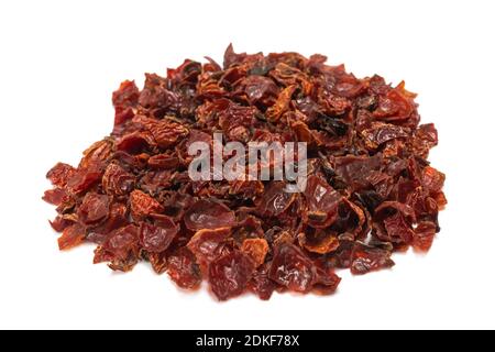 Stack of rosehips berries pile isolated on white Stock Photo