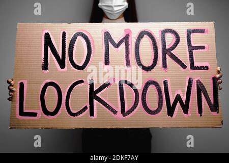 Protestive placard against coronavirus lockdowns against wall Stock Photo