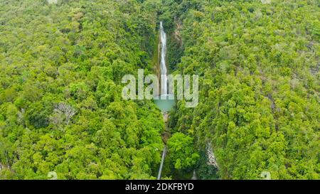 Aerial view of Mantayupan waterfalls in a mountain gorge in the tropical jungle, Philippines, Cebu. Waterfall in the tropical forest. Stock Photo