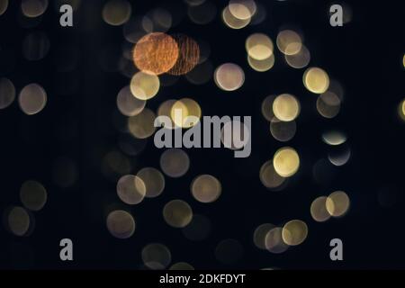 Abstract gold colorfull bokeh texture on black background. Stock Photo