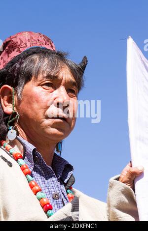 Leh, Jammu and Kashmir, India - Sep 01, 2012: the Ladakhi man in traditional clothing with the familiar hat on the traditional Ladakh festival on sunn Stock Photo