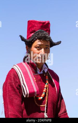 Leh, Jammu and Kashmir, India - Sep 01, 2012: smiling Ladakhi man in traditional clothing with the familiar hat on the traditional Ladakh festival on Stock Photo