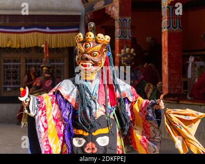 Unidentified monk in mask performs a religious masked and costumed mystery dance of Tibetan Buddhism during the Cham Dance Festival in Lamayuru monast Stock Photo