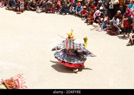 Lamayuru, India - June 17, 2012: unidentified monk in deer mask performs a religious masked and costumed mystery dance of Tibetan Buddhism around the Stock Photo