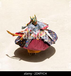Unidentified monk performs a religious masked and costumed mystery dance of Tibetan Buddhism during the Cham Dance Festival in Lamayuru monastery, Ind Stock Photo