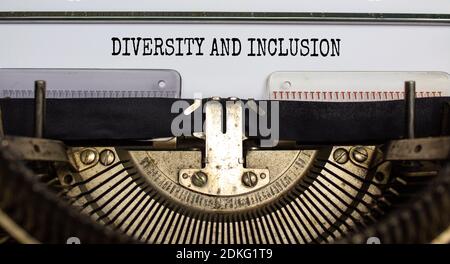 Diversity and inclusion symbol. Text 'Diversity and inclusion' typed on retro typewriter. Business and diversity and inclusion concept. Beautiful back Stock Photo