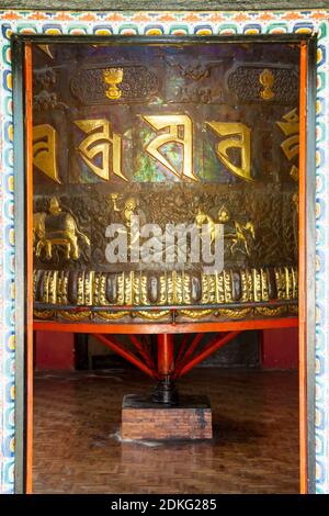 Tashiding, India - December 30, 2011: Giant ornate prayer wheel in a Buddhist monastery Tashiding, Sikkim, India Stock Photo