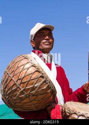 Leh, Jammu and Kashmir, India - Sep 01, 2012: The Ladakhi Man, drummer with traditional Nagara drums on the traditional Ladakh festival on sunny day o Stock Photo