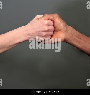 hand gesture showing no discrimination between black and white on dark background stock photo Stock Photo