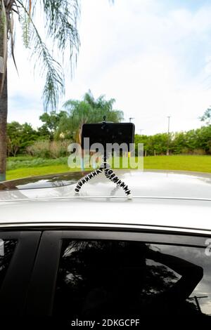 Articulating mini tripod for photography holding a smartphone Stock Photo