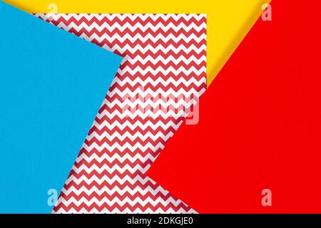 Abstract geometric fashion papers texture background in yellow, red, pink, blue colors. Top view, flat lay Stock Photo