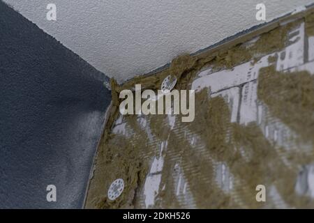 Installation of new floor of wooden natural planks and mineral wool insulation for isolation and keeping warmth. Modern technologies, warm comfortable Stock Photo