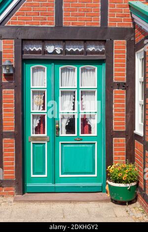 Old ornate door on a half-timbered house, Nordseeheilbad Otterndorf, Lower Saxony, Germany Stock Photo