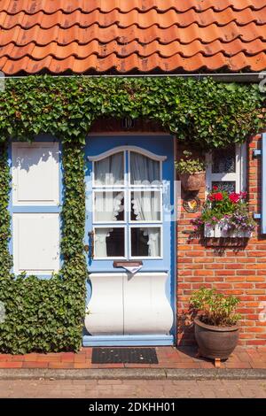 Old ornate door on a residential building, Nordseeheilbad Otterndorf, Lower Saxony, Germany Stock Photo