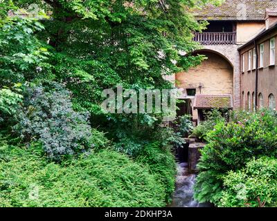 Water wheel, historical water wheel, mill wheel, trees, bank reinforcement, arch, stone arch, city wall, city moat, Lech Canal, canal, UNESCO World Heritage Site, World Heritage Monument, UNESCO World Heritage Monument, historic old town, old town, historical landmark, place of interest Stock Photo