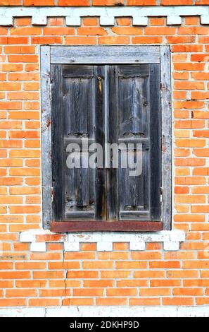 Abstract shuttered window in an old abandoned house Stock Photo
