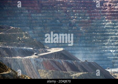 Trucks carrying ore in the Santa Rita or Chino open pit copper mine, near Silver City, New Mexico Stock Photo