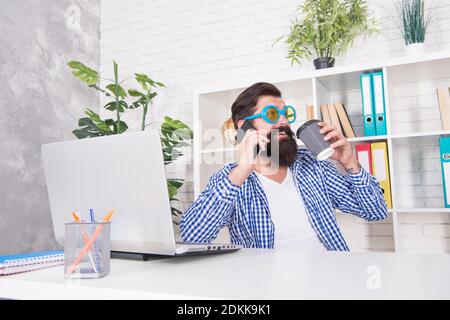 Sip happens. Businessman drink coffee talking on mobile phone. Business conversation. Enjoying coffee break. Hot cup. Breakfast tea. Morning habit. Office lifestyle. Simple pleasure. Stock Photo
