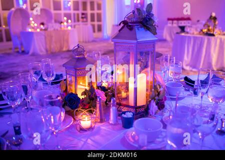 Romantic table setup for special event with candles indoor close up Stock Photo