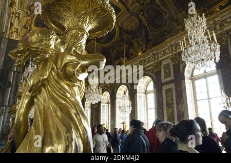 Gilded sculptured gueridons in the Hall of Mirrors (Galerie des Glaces) of the royal Palace of Versailles, France. Stock Photo