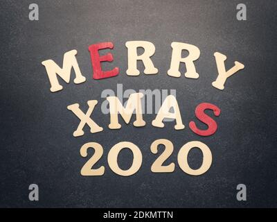 The words Merry Xmas 2020 on a chalkboard using as greeting card or Christmas background Stock Photo