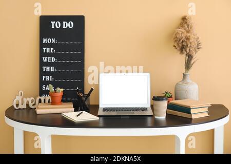 Interior of modern workplace with laptop Stock Photo
