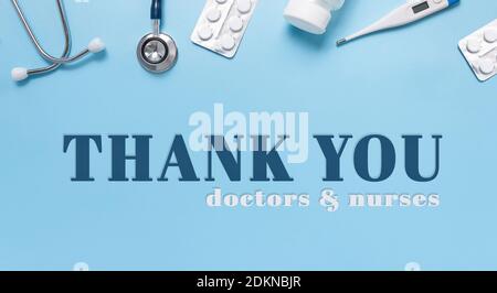 International Thank You day for Medical staff and workers. Medical flatlay. Blue background. Stethoscope, thermometer, pills. Medical equipment. Stock Photo