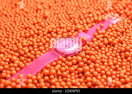 Wrist watch on color beads Stock Photo