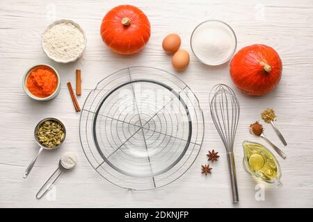 Ingredients for preparing pumpkin pie on table Stock Photo