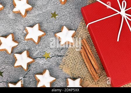 German star shaped glazed Christmas cookies called 'Zimtsterne' made with amonds, egg white, sugar, cinnamon and flour Stock Photo