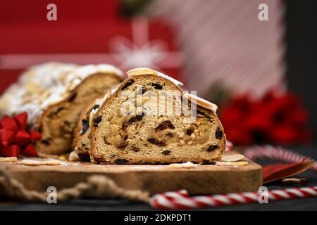 Slice of German Stollen cake, a fruit bread with nuts, spices, and dried fruits with powdered sugar traditionally served during Christmas time Stock Photo