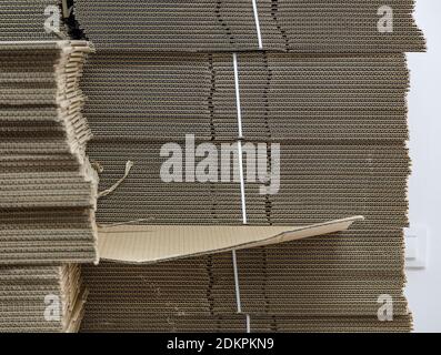 New carton boxes for packing are stacked in a stock Stock Photo