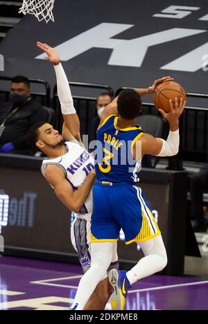 Sacramento, CA, USA. 15th Dec, 2020. Golden State Warriors guard Jordan Poole (3) drives over Sacramento Kings guard Justin James (10) during a preseason game at Golden 1 Center on Tuesday, Dec 15, 2020 in Sacramento. Credit: Paul Kitagaki Jr./ZUMA Wire/Alamy Live News Stock Photo