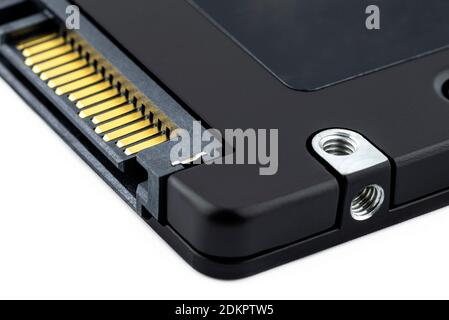 Macro shots of the SATA connector and the power connector on the solid-state drive, visible screw fixing. Stock Photo