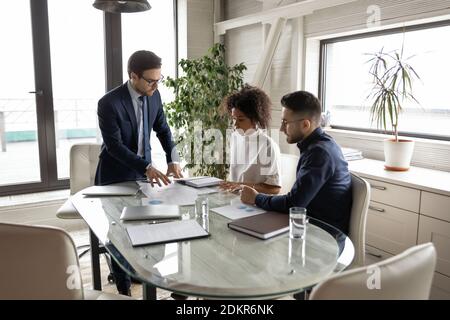 Multiracial businesspeople brainstorm at meeting in office Stock Photo