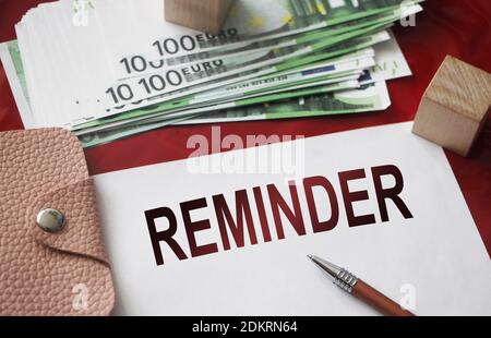 Notice Reminder Word, pen, pink leather wallet and money banknotes. Business appointment concept. Stock Photo