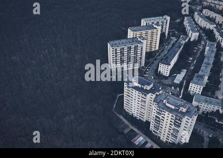 Aerial View Of Buildings By Forest