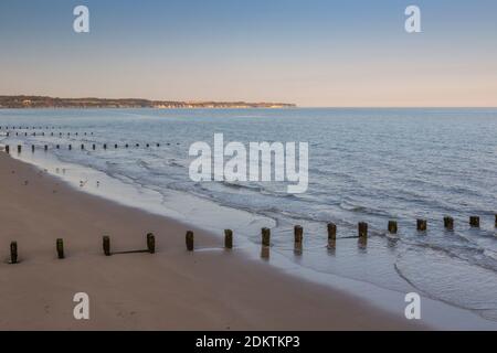 View of the Bridlington Sea Front Beach and Flamborough Head in distance at sunset, Bridlington, East Yorkshire, England, United Kingdom, Europe Stock Photo