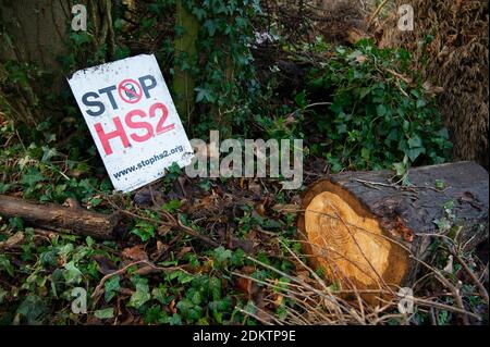 Wendover, Buckinghamshire, UK. 15th December, 2020. Stop HS2 signs outside the camp. Stop HS2 activists are busy at their Wendover Active Resistance Camp getting ready for the winter and building more tree houses. Their camp is situated in the direct route of the HS2 High Speed Rail link from London to Birmingham. The activists living at the camp are a collective of autonomous individuals with the aim of protecting the environment and wildlife. The controversial and over budget HS2 rail link puts 693 wildlife areas, 33 SSSIs and 108 ancient woodlands at risk. Credit: Maureen McLean/Alamy Stock Photo