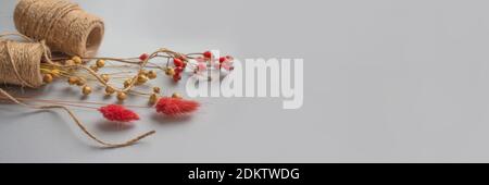 Banner composition with natural jute twine roll, linen or cannabis, on light background with copyspace for text or your presentation. Handmade and Stock Photo