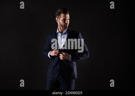 Portrait of his he nice attractive elegant luxurious rich wealthy content classy chic guy shark executive director model fastening button isolated on Stock Photo