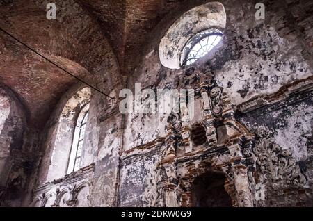 Ancient window in the old synagogue in Zhovkva. Monochrome mystical photo. Stock Photo